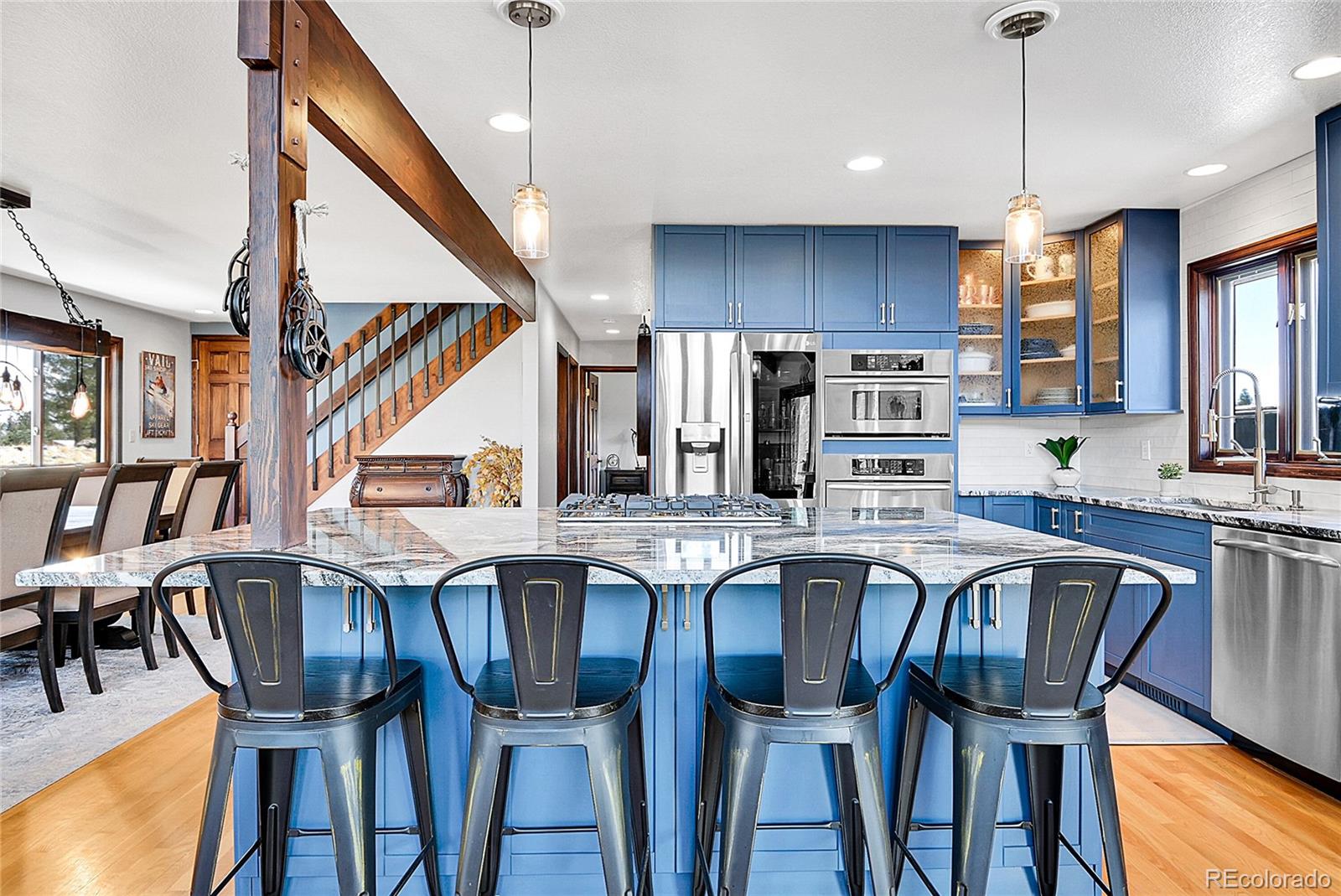1567 Tapadero Road Bailey, CO 80421 - Photo 4 of 26 a view of a dining room with furniture kitchen and wooden floor