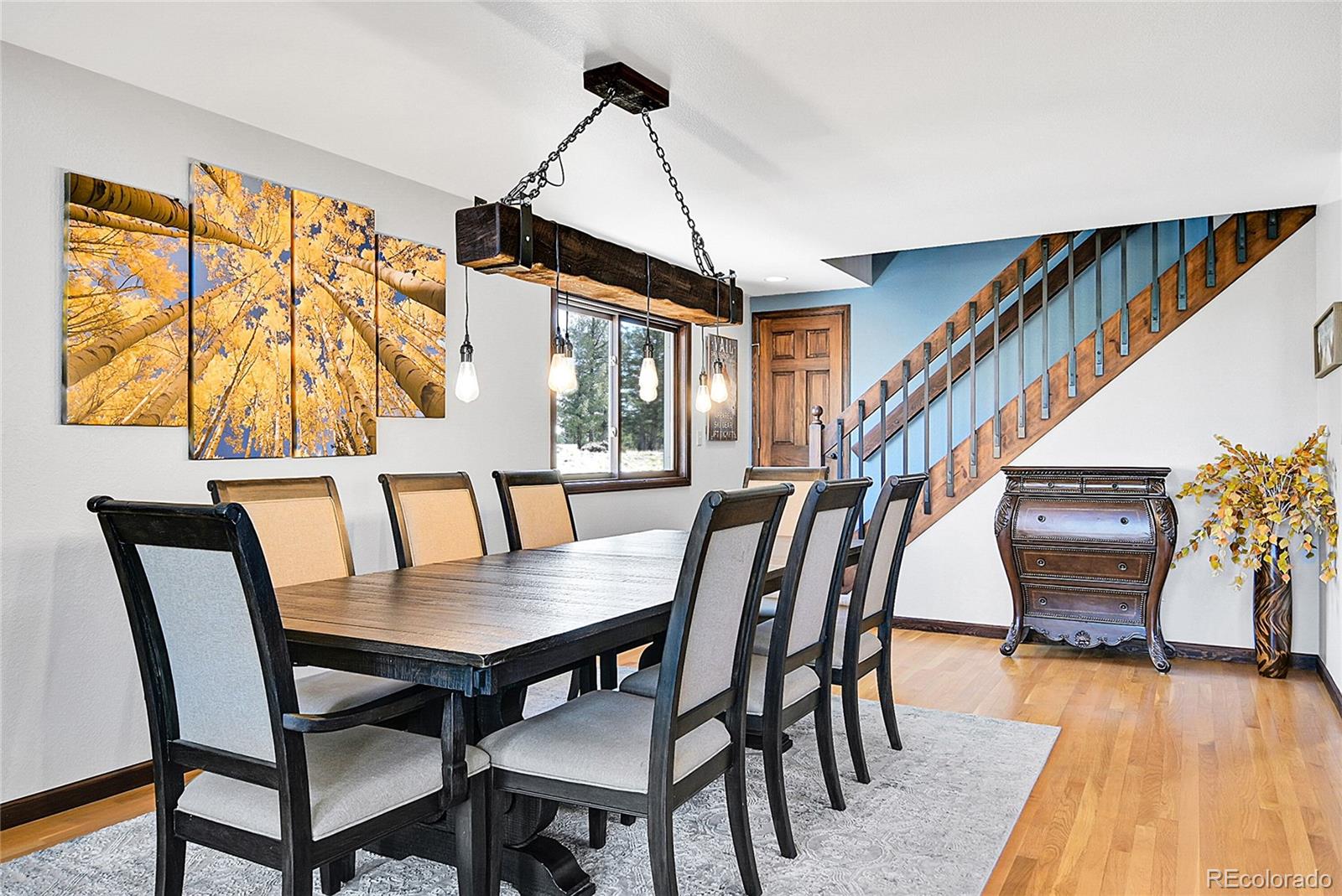 1567 Tapadero Road Bailey, CO 80421 - Photo 6 of 26 a view of a dining room with furniture window and wooden floor