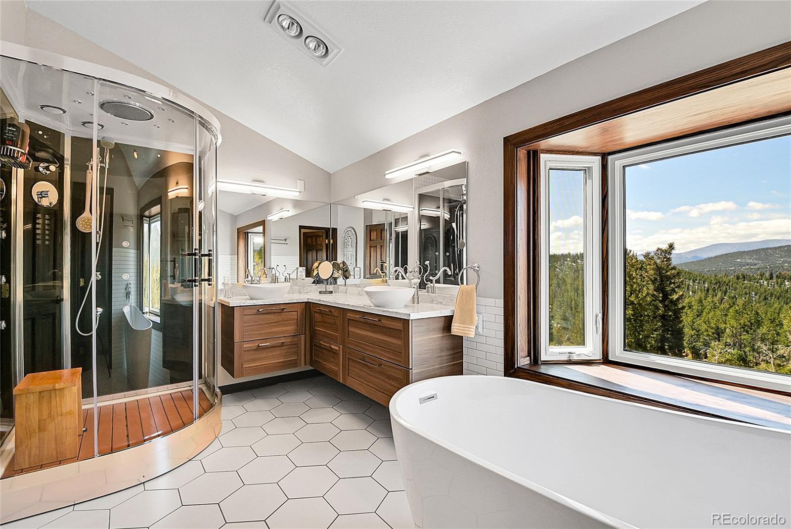 1567 Tapadero Road Bailey, CO 80421 - Photo 9 of 26 a large white tub sitting in a bathroom