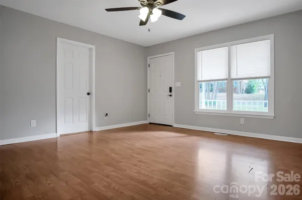 a view of an empty room with a window