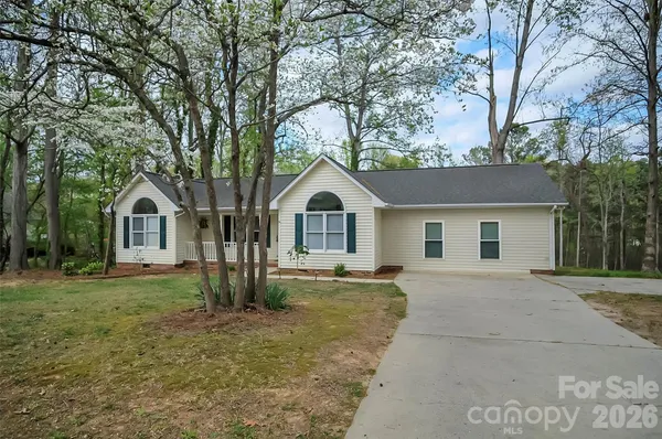 a house with trees in the background