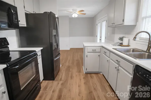 a kitchen with a sink stove and refrigerator