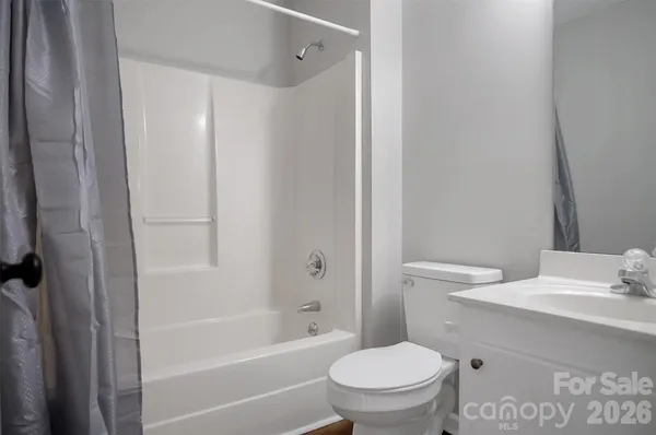 a bathroom with a toilet a sink and a bathtub