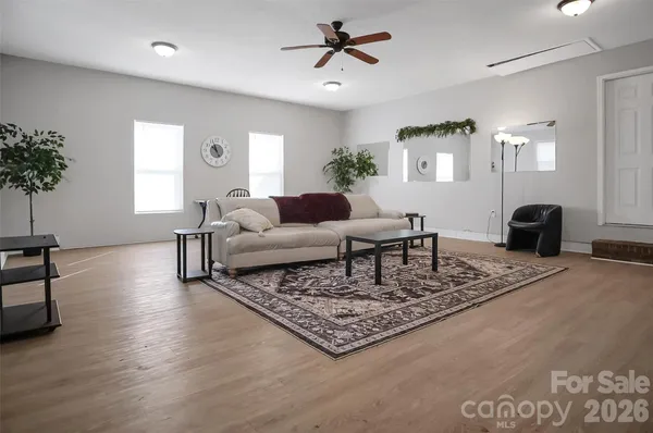 a living room with furniture and a rug