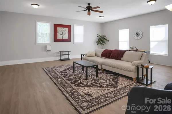a living room with furniture and a rug