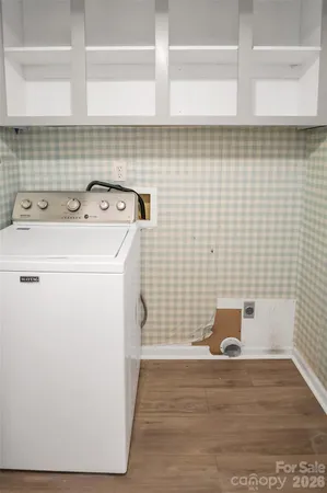 a bathroom with a sink and a washing machine