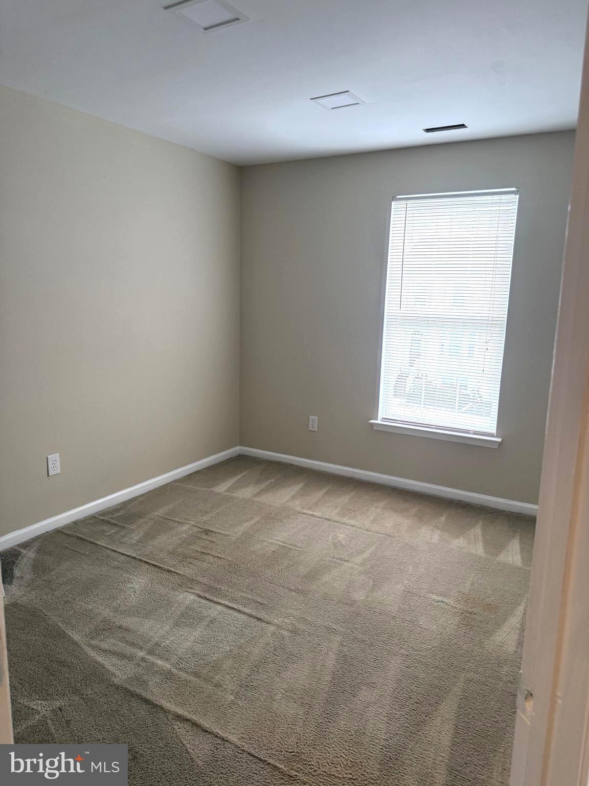 19 Spring Drive Newark, DE 19702 - Photo 36 of 47 an empty room with a window