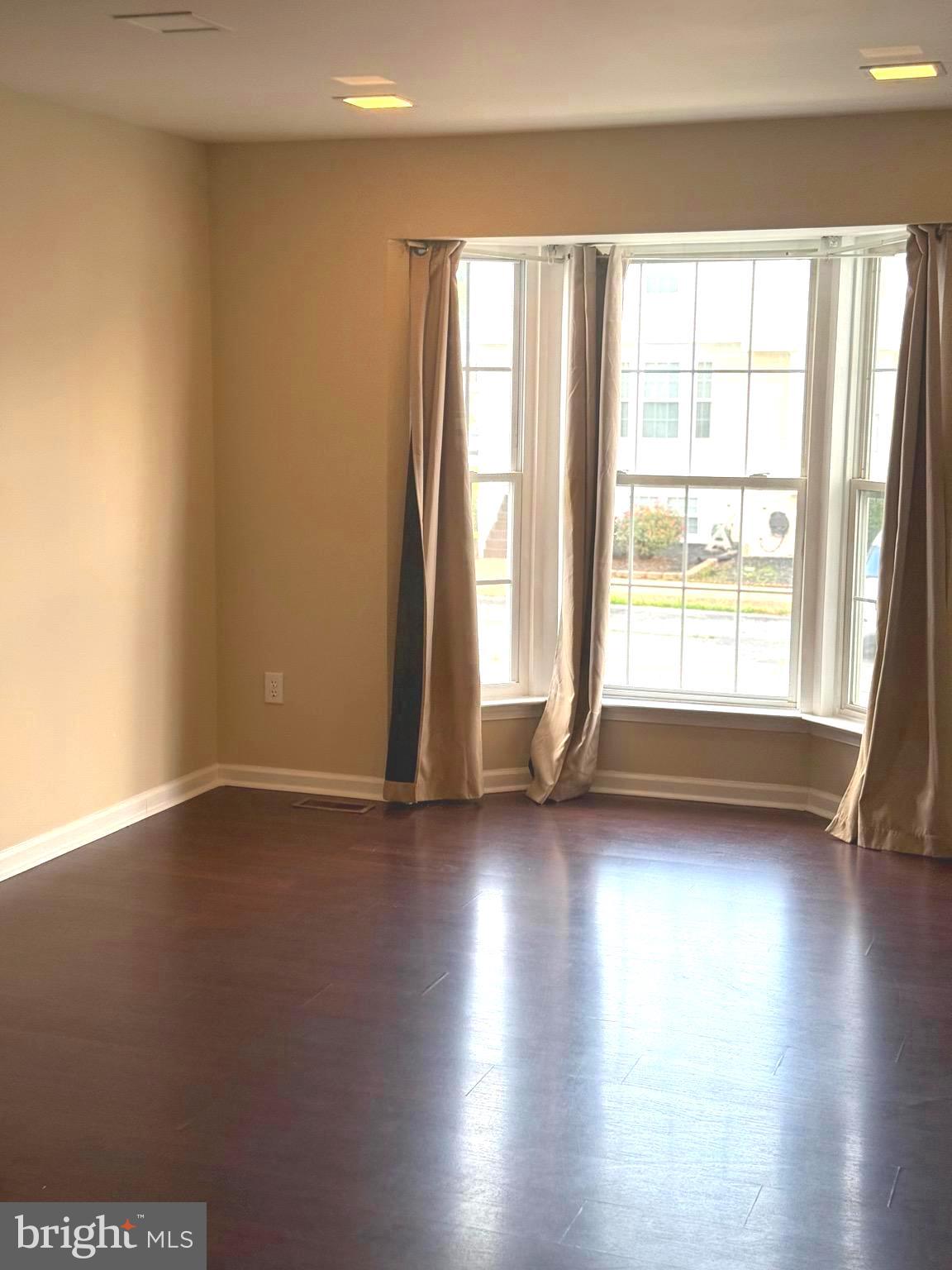 19 Spring Drive Newark, DE 19702 - Photo 6 of 47 a view of room with window and wooden floor