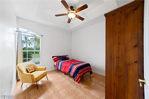 a bedroom with a bed and a chair