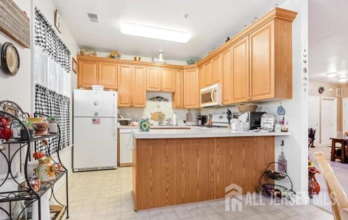 110 Kyle Way Ewing, NJ 08628 - Photo 19 of 39 a kitchen with stainless steel appliances granite countertop a refrigerator sink and cabinets