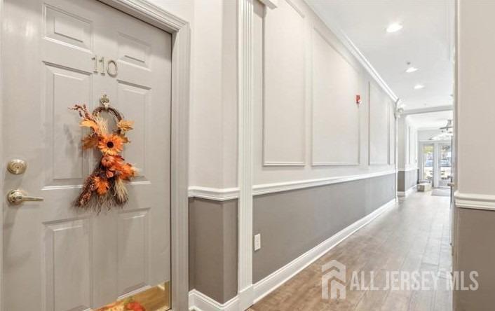 110 Kyle Way Ewing, NJ 08628 - Photo 2 of 39 a view of a hallway to a livingroom with wooden floor and windows