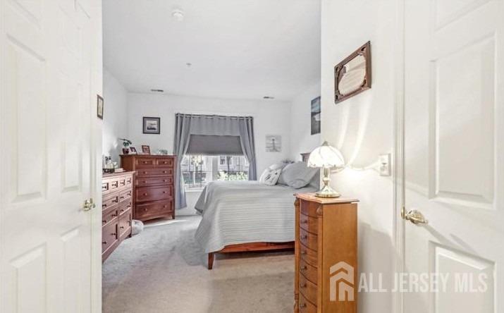 110 Kyle Way Ewing, NJ 08628 - Photo 22 of 39 a bedroom with furniture and a flat tv screen