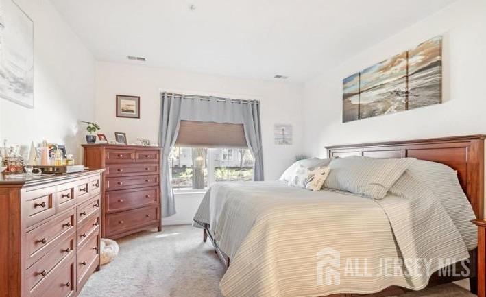 110 Kyle Way Ewing, NJ 08628 - Photo 23 of 39 a bedroom with a bed and a dresser