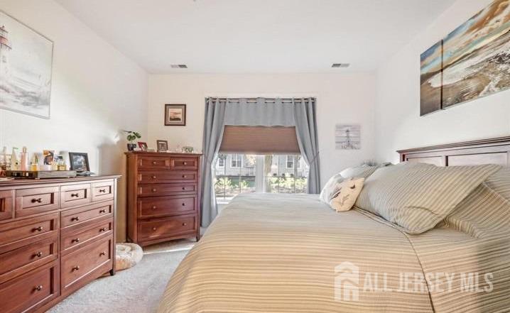 110 Kyle Way Ewing, NJ 08628 - Photo 24 of 39 a bedroom with a bed and a dresser