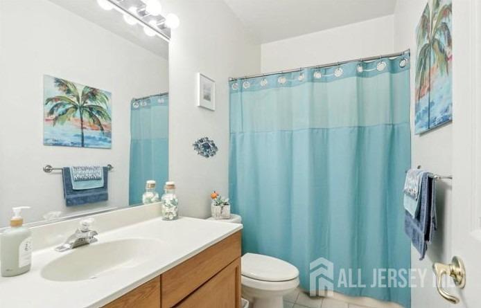 110 Kyle Way Ewing, NJ 08628 - Photo 29 of 39 a bathroom with a sink a toilet a mirror and shower curtain