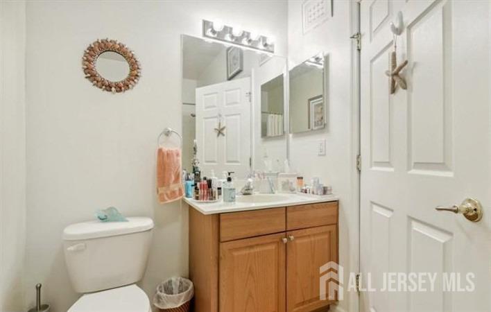 110 Kyle Way Ewing, NJ 08628 - Photo 34 of 39 a bathroom with a sink a toilet and mirror