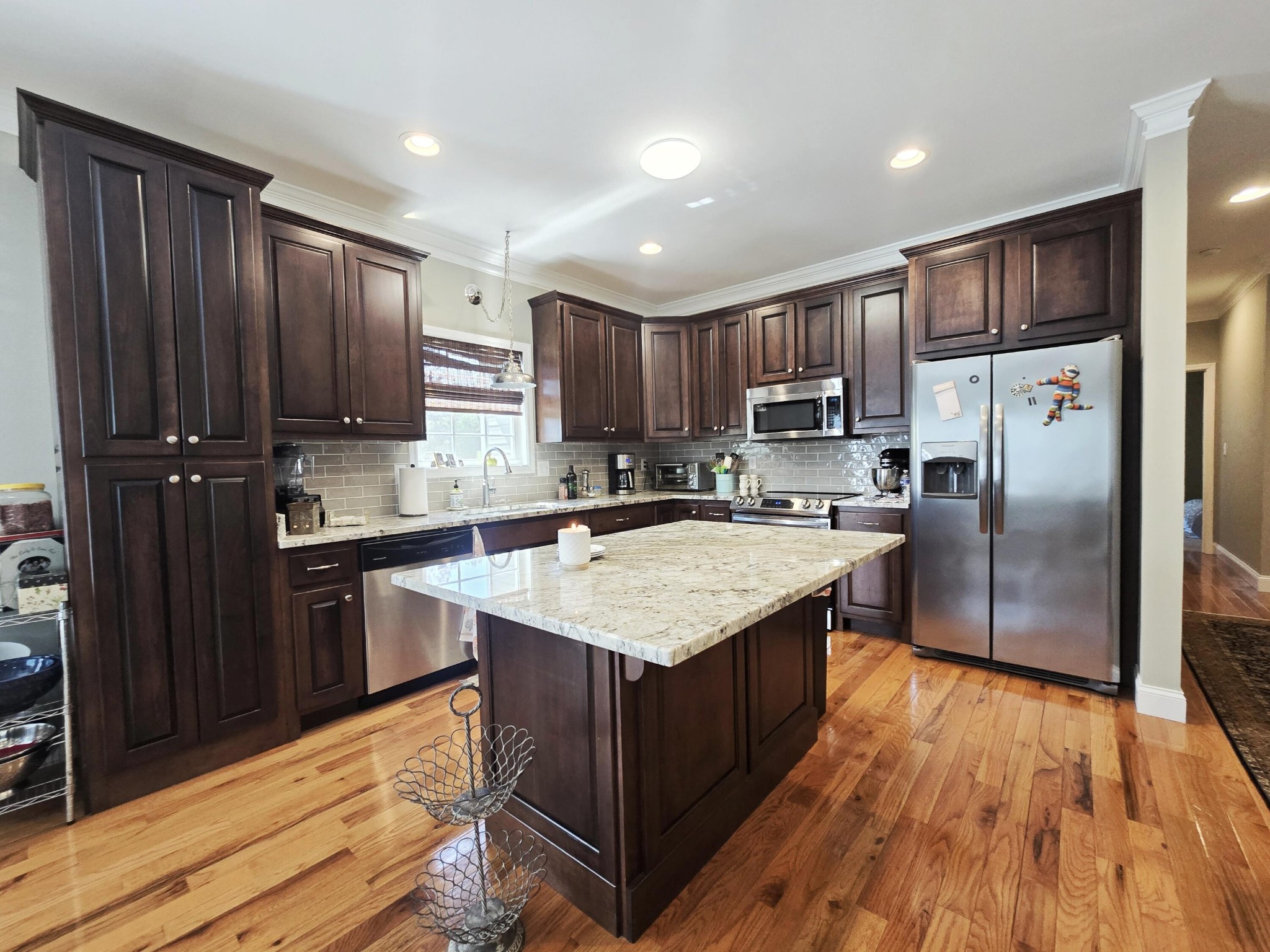 231 Clara Lane Dayton, TN 37321 - Photo 5 of 17 a kitchen with stainless steel appliances granite countertop wooden cabinets a refrigerator and a sink