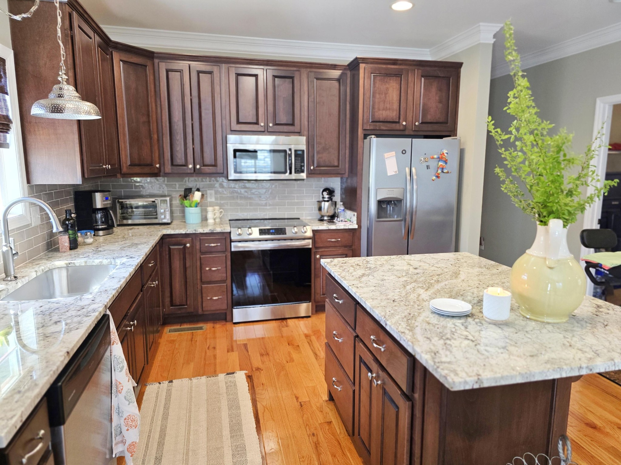 231 Clara Lane Dayton, TN 37321 - Photo 6 of 17 a kitchen with stainless steel appliances granite countertop a sink dishwasher stove top oven and refrigerator