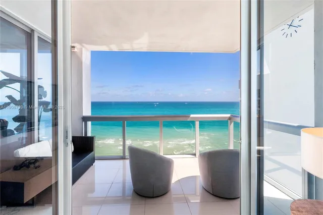 a living room with a table and a potted plant