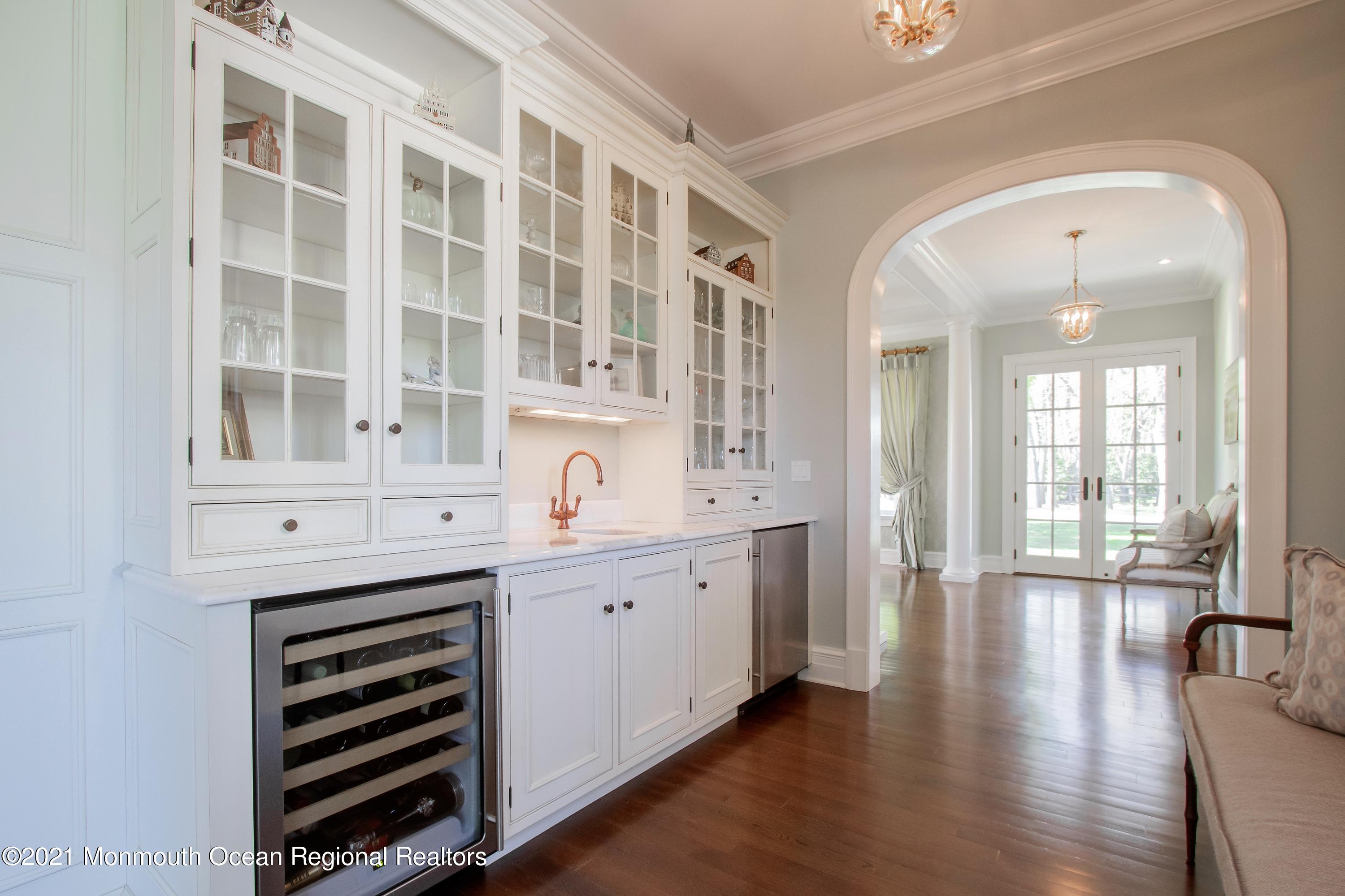 21 Conover Lane Rumson, NJ 07760 - Photo 10 of 40 a spacious bathroom with a double vanity sink and a window