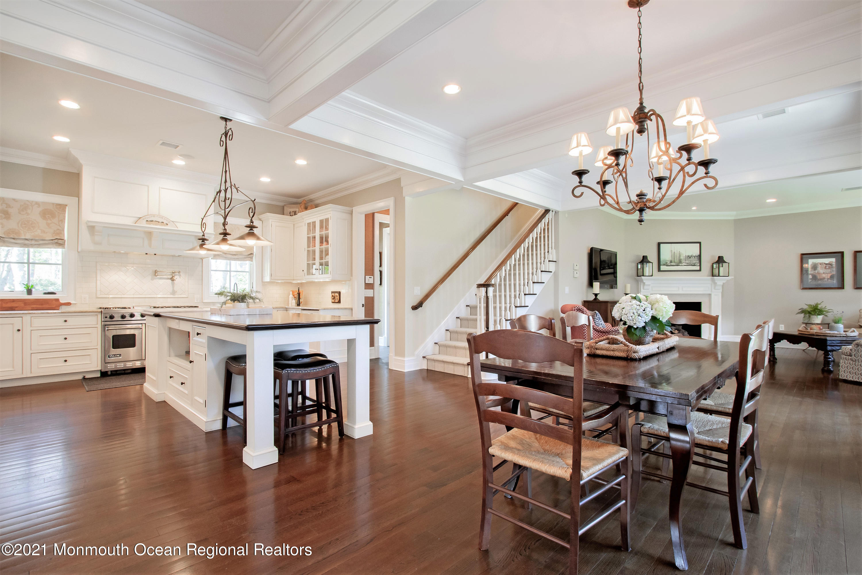 21 Conover Lane Rumson, NJ 07760 - Photo 14 of 40 a view of dining room and livingroom with furniture wooden floor a chandelier