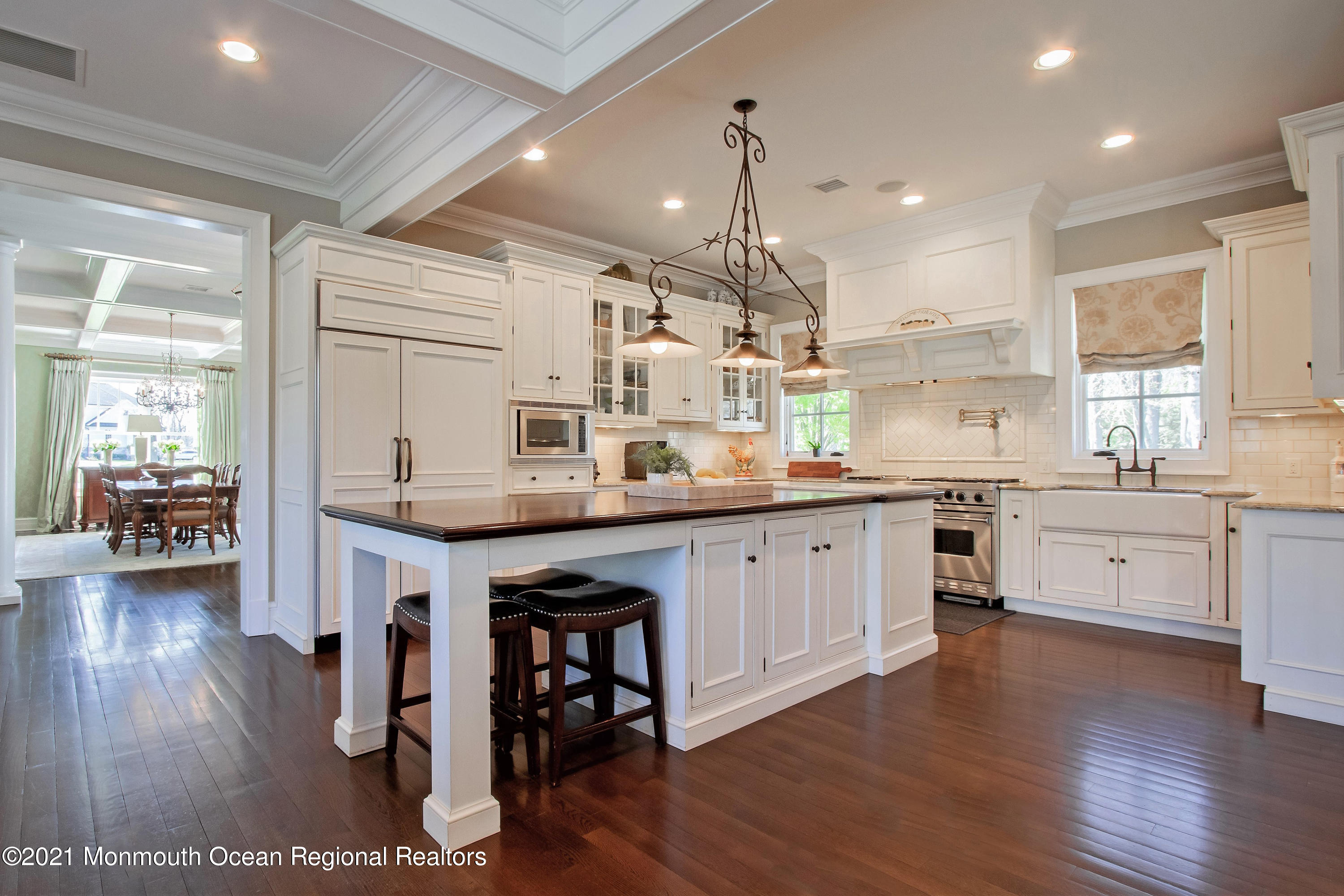 21 Conover Lane Rumson, NJ 07760 - Photo 15 of 40 a kitchen with stainless steel appliances kitchen island granite countertop a stove a sink a refrigerator and white cabinets with wooden floor