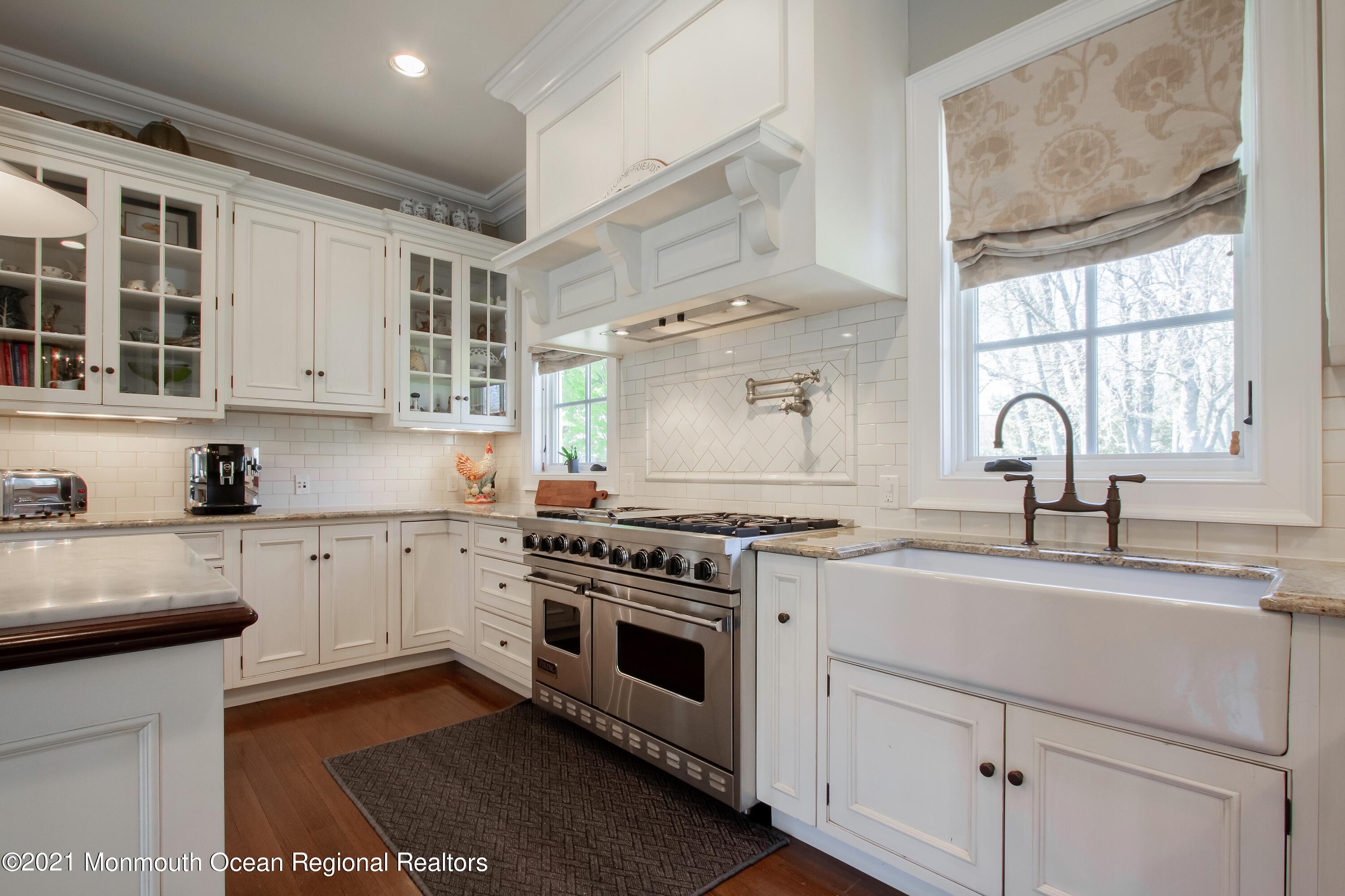 21 Conover Lane Rumson, NJ 07760 - Photo 16 of 40 a kitchen with cabinets stainless steel appliances and a sink