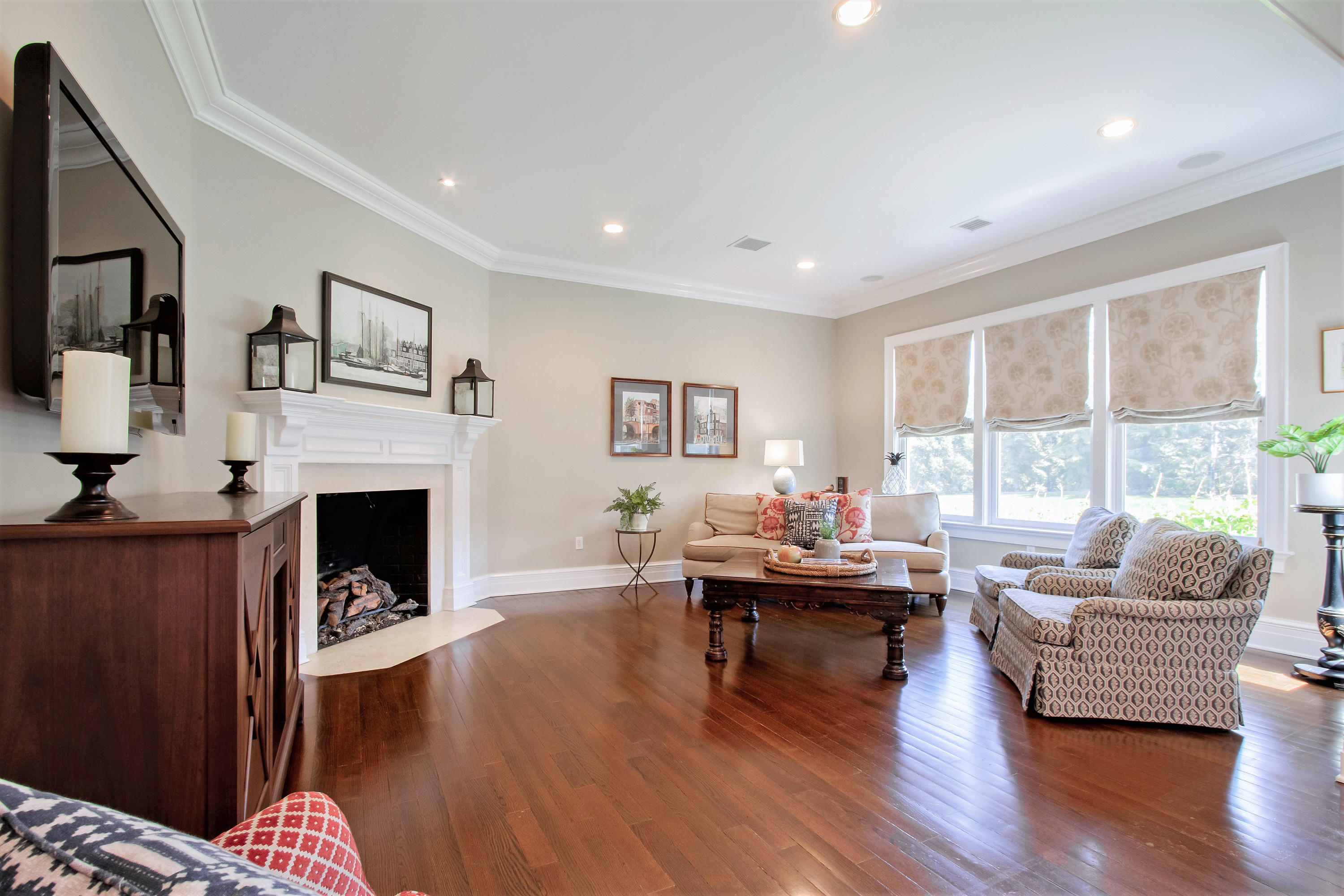 21 Conover Lane Rumson, NJ 07760 - Photo 18 of 40 a living room with fireplace furniture and a large window