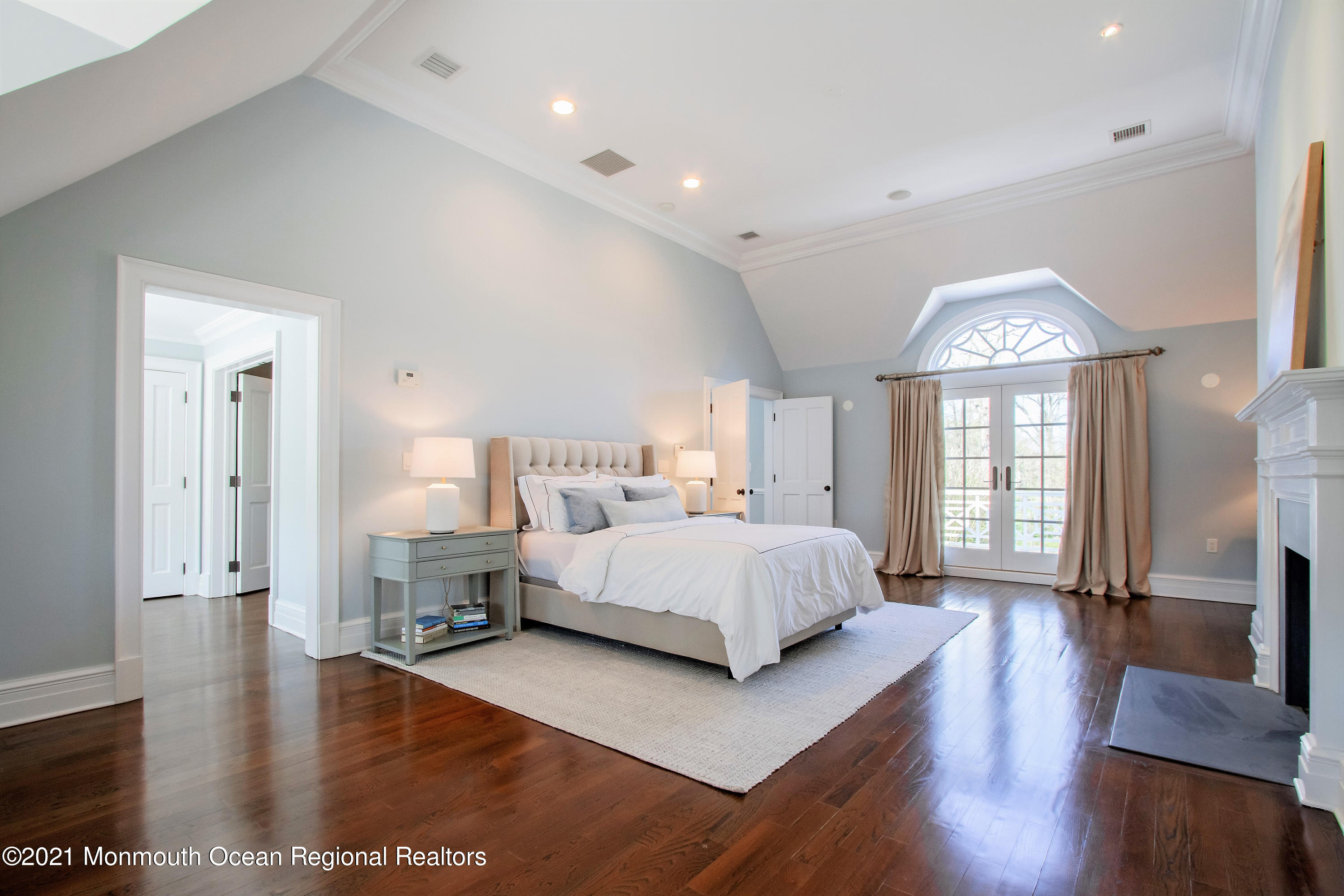 21 Conover Lane Rumson, NJ 07760 - Photo 26 of 40 a spacious bedroom with a bed and wooden floor