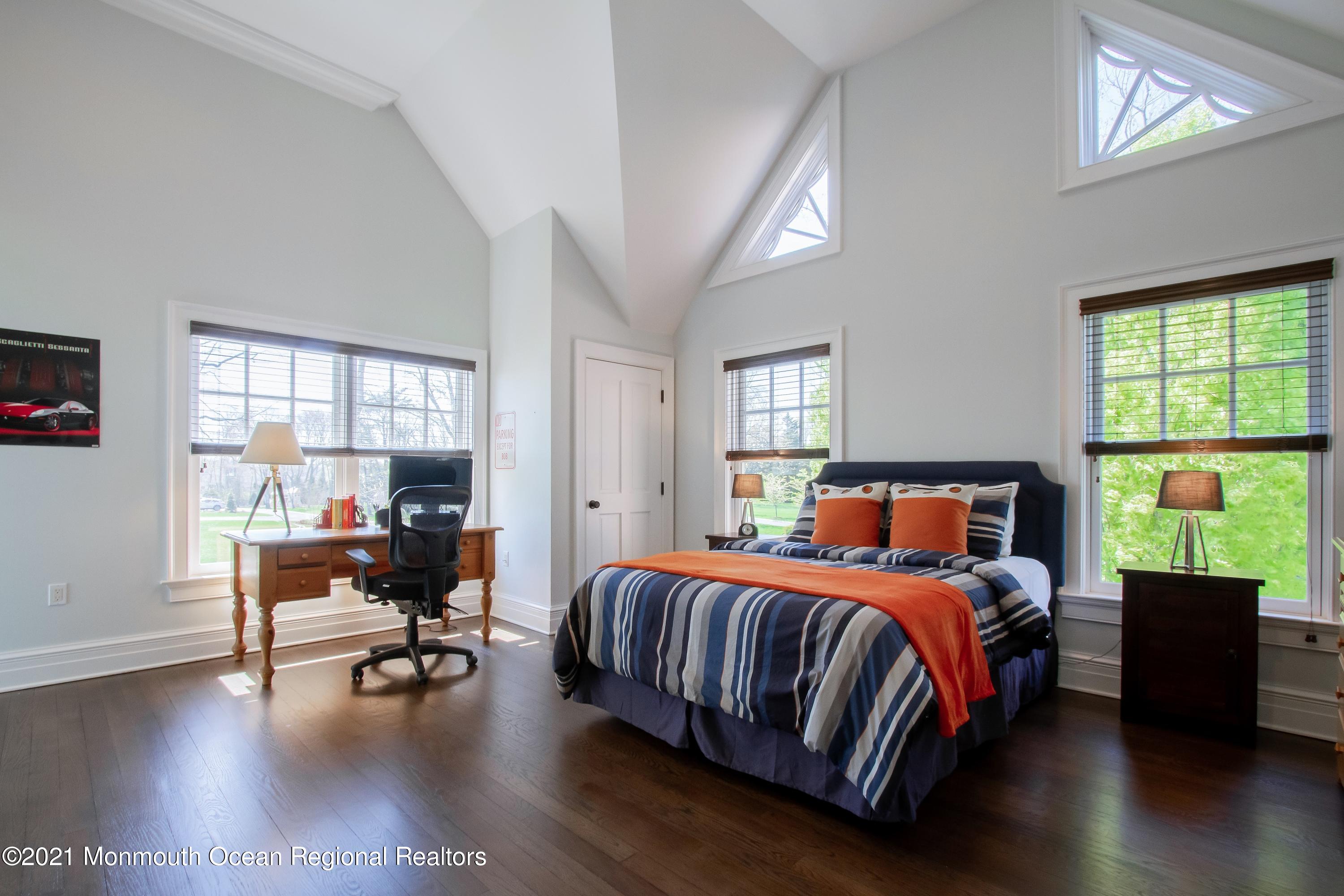 21 Conover Lane Rumson, NJ 07760 - Photo 32 of 40 a bedroom with a bed chair and a window