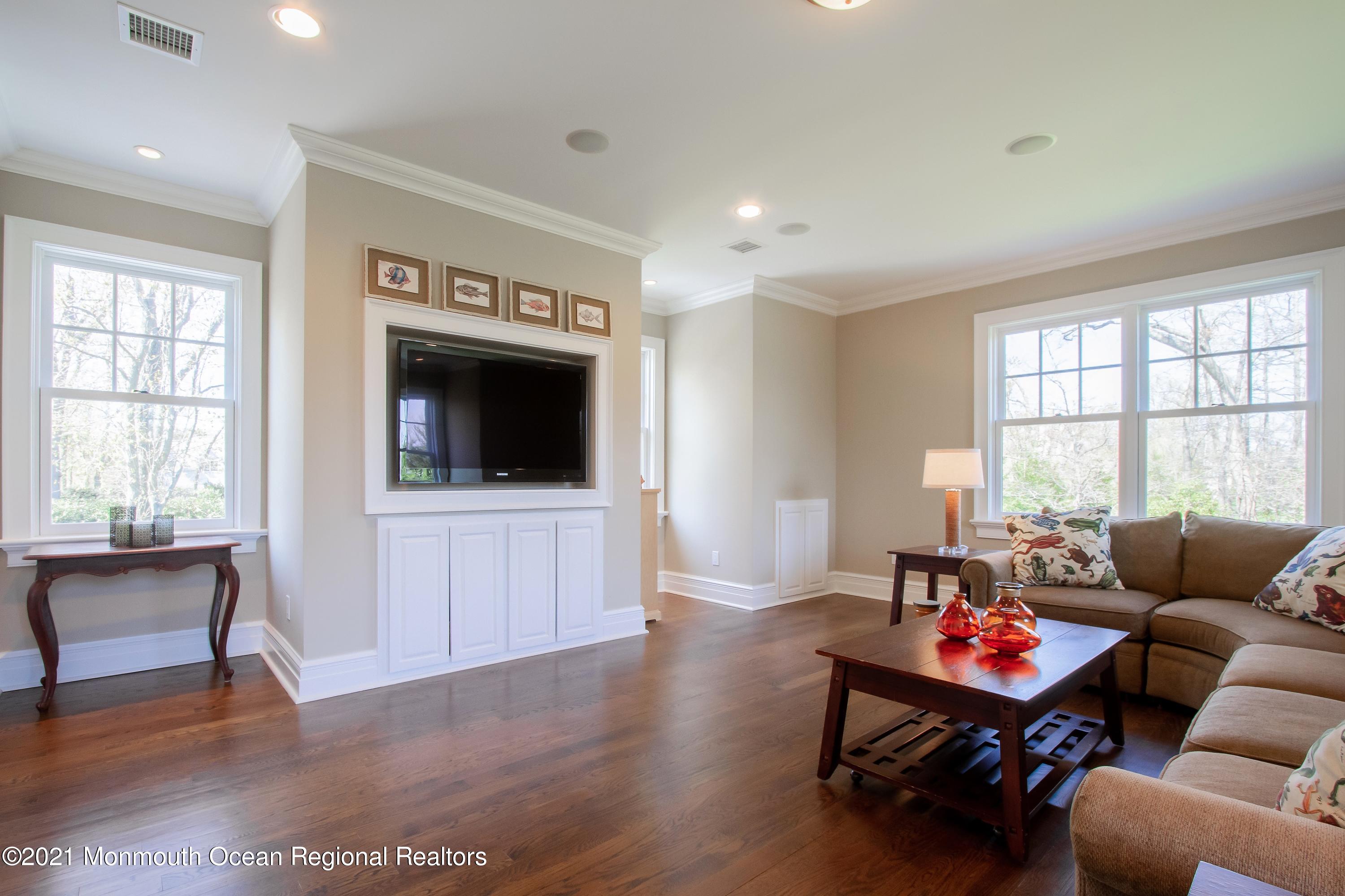 21 Conover Lane Rumson, NJ 07760 - Photo 35 of 40 a living room with furniture and a flat screen tv