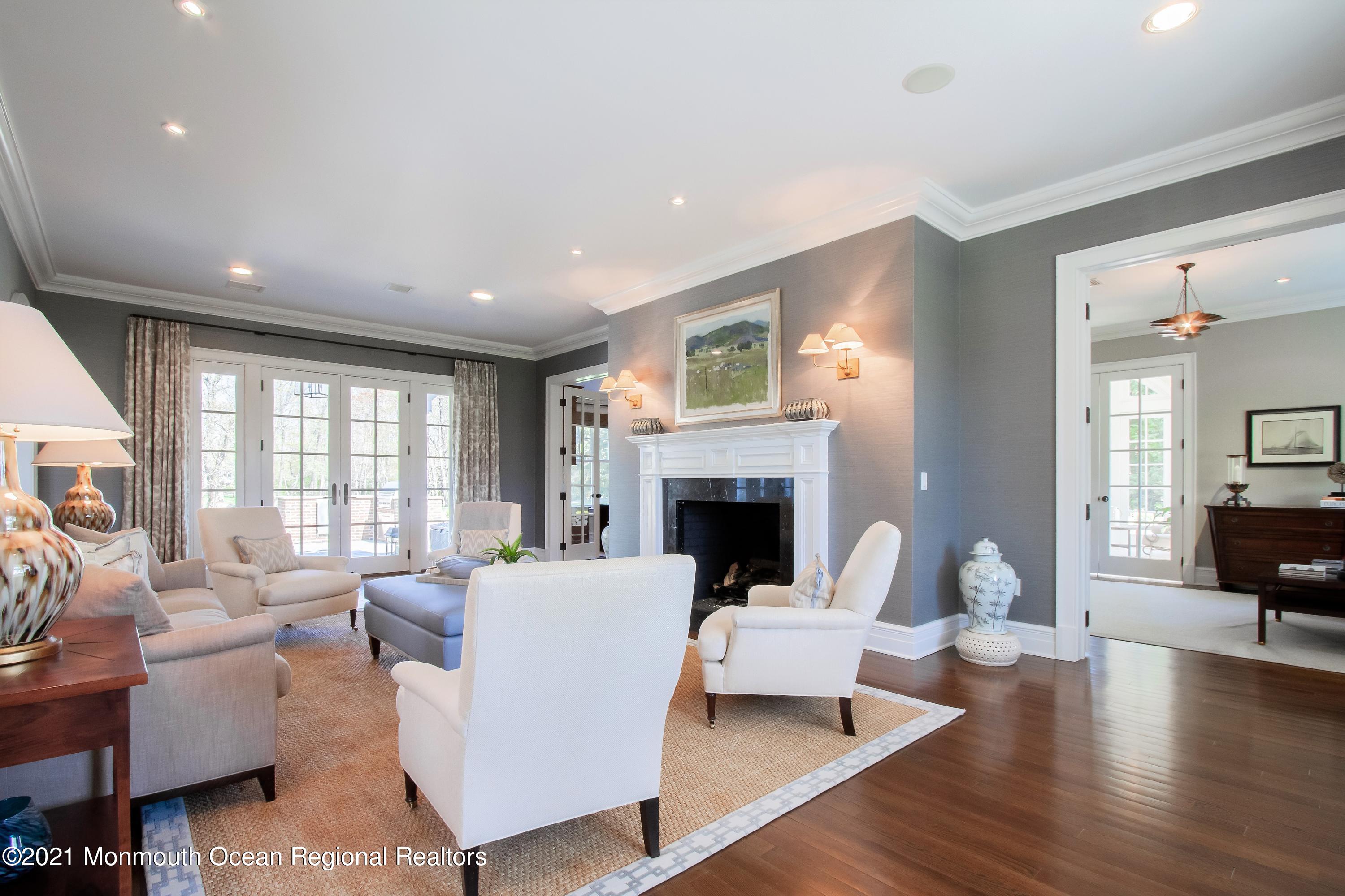 21 Conover Lane Rumson, NJ 07760 - Photo 6 of 40 a living room with fireplace furniture and a large window