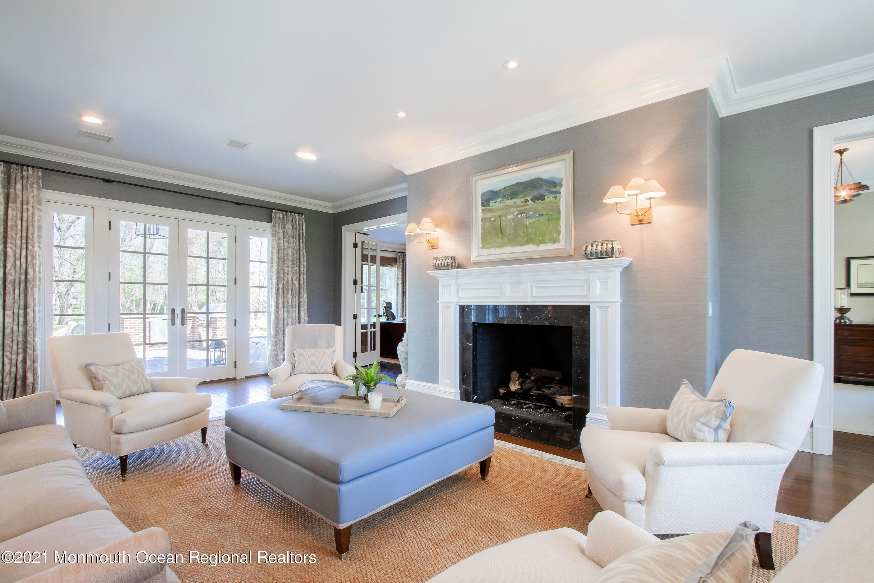 21 Conover Lane Rumson, NJ 07760 - Photo 7 of 40 a living room with furniture and a fireplace