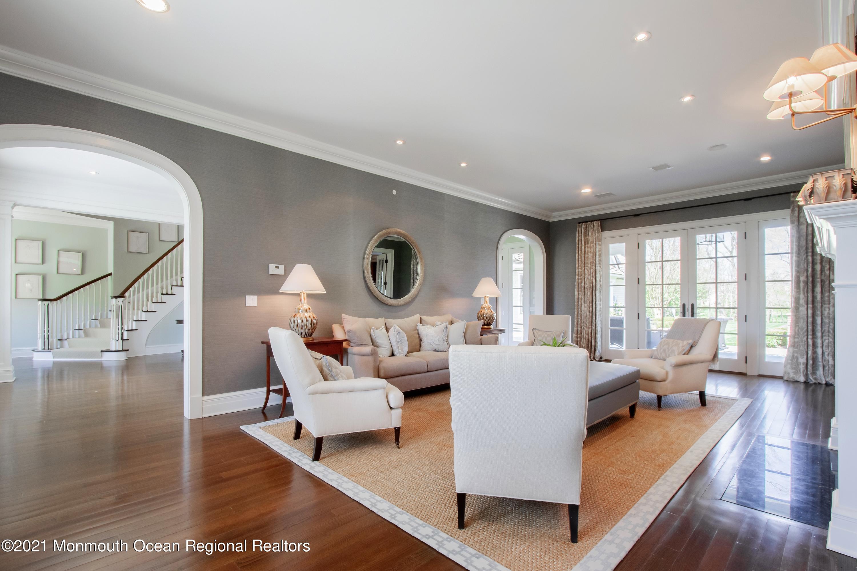 21 Conover Lane Rumson, NJ 07760 - Photo 8 of 40 a living room with fireplace furniture and a wooden floor