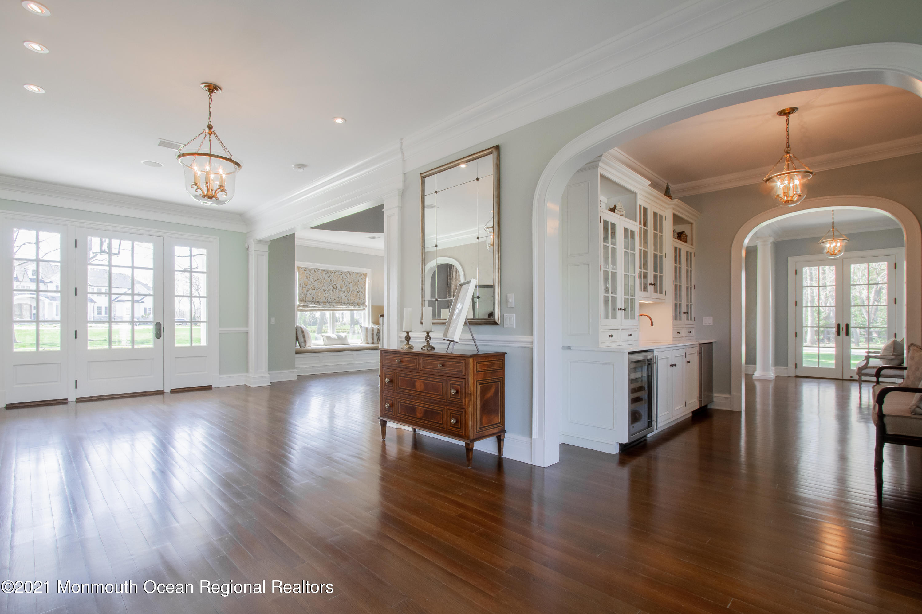 21 Conover Lane Rumson, NJ 07760 - Photo 9 of 40 a view of a big room with wooden floor and windows