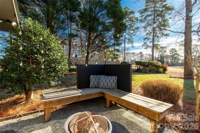 a roof deck with couches and a table