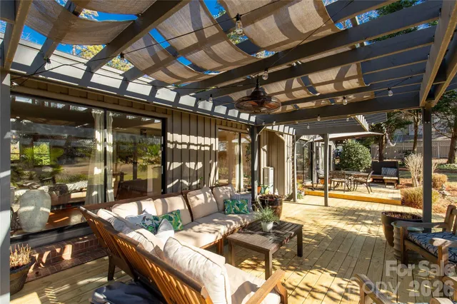 a outdoor space with lots of furniture and glass windows