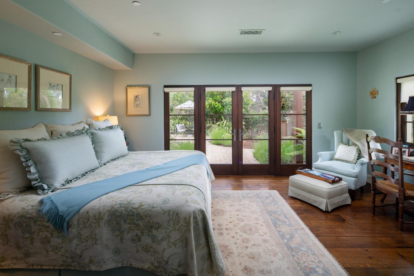 1565 Riata Road Pebble Beach, CA 93953 - Photo 15 of 23 a spacious bedroom with a bed couch and a large window