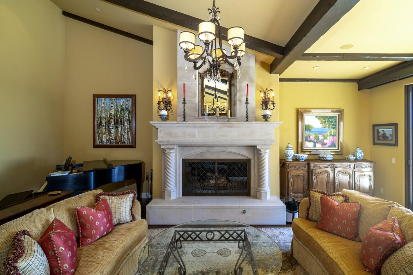 1565 Riata Road Pebble Beach, CA 93953 - Photo 6 of 23 a living room with furniture a chandelier and a fireplace