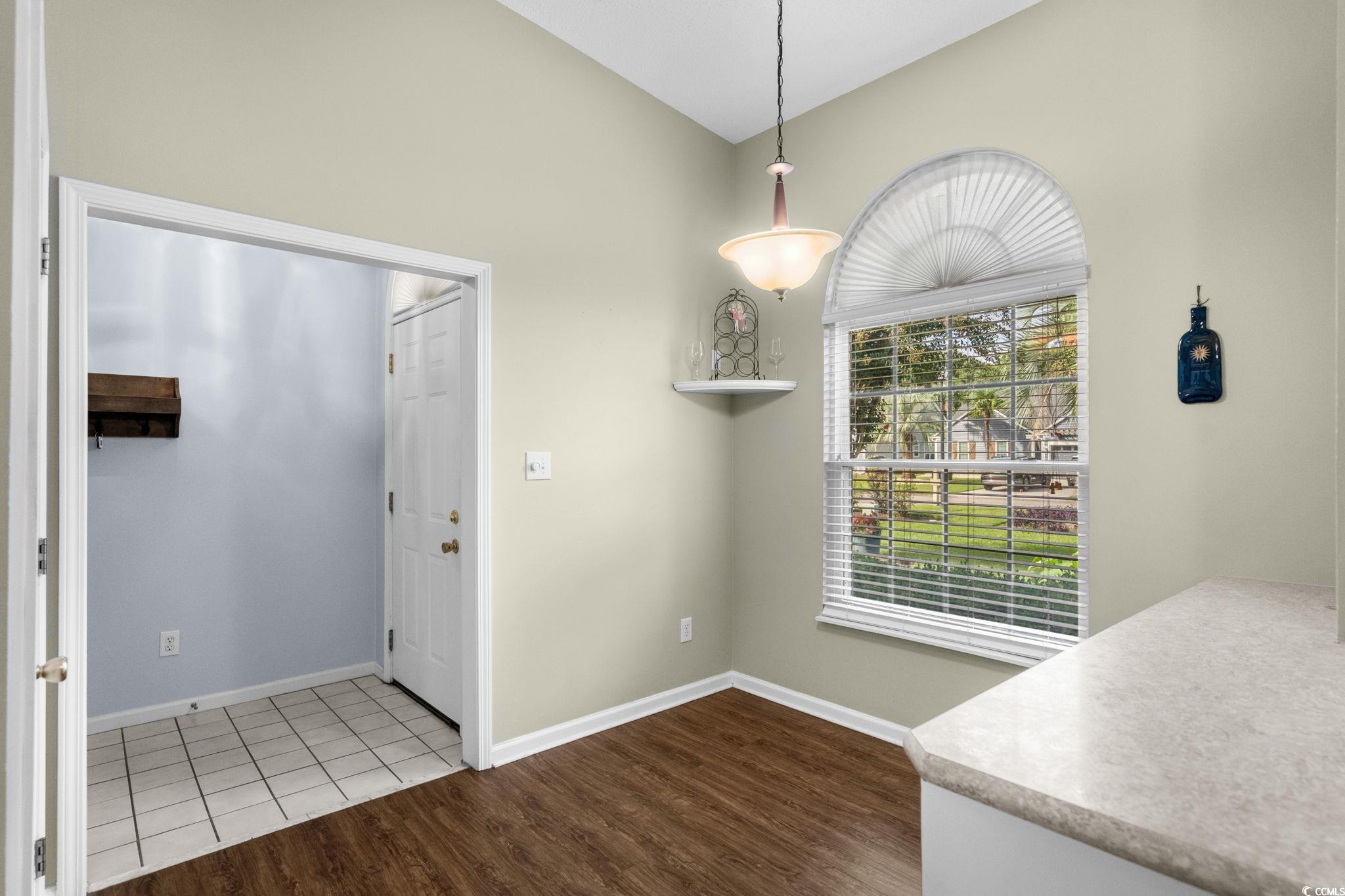9568 Indigo Club Drive Murrells Inlet, SC 29576 - Photo 13 of 40 Entryway featuring dark wood-type flooring and vaulted ceiling