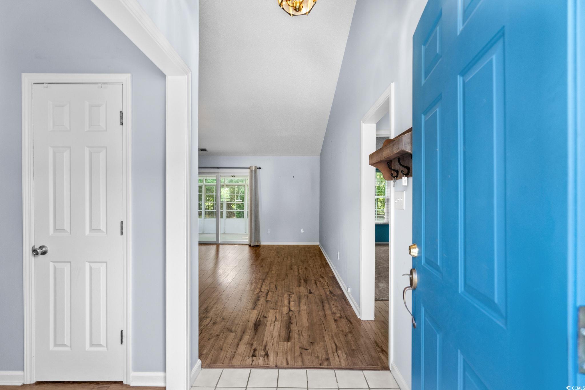 9568 Indigo Club Drive Murrells Inlet, SC 29576 - Photo 2 of 40 Entryway featuring lofted ceiling and wood finished floors