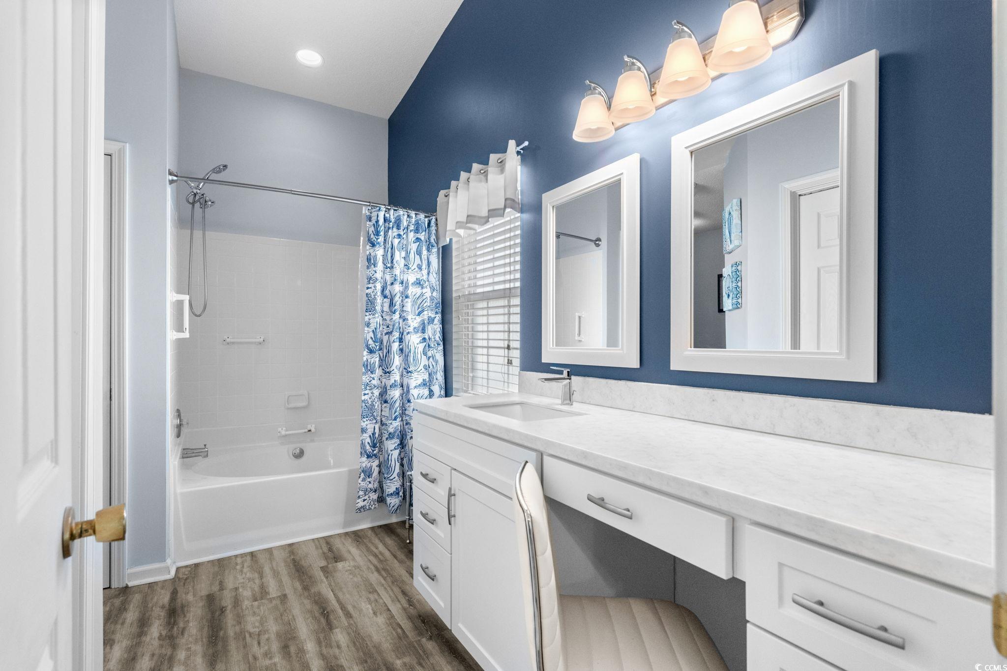 9568 Indigo Club Drive Murrells Inlet, SC 29576 - Photo 24 of 40 Bathroom featuring shower / tub combo, vanity, and dark wood-style floors