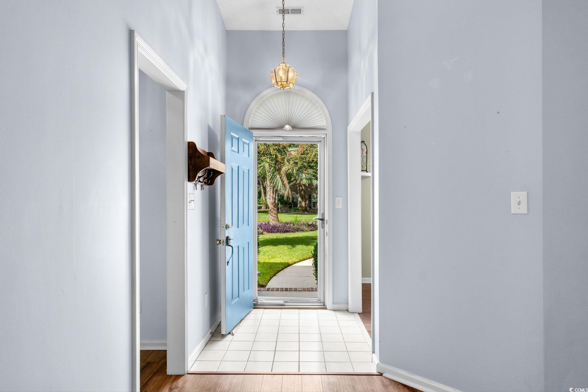9568 Indigo Club Drive Murrells Inlet, SC 29576 - Photo 3 of 40 Foyer entrance featuring baseboards and light wood-style floors