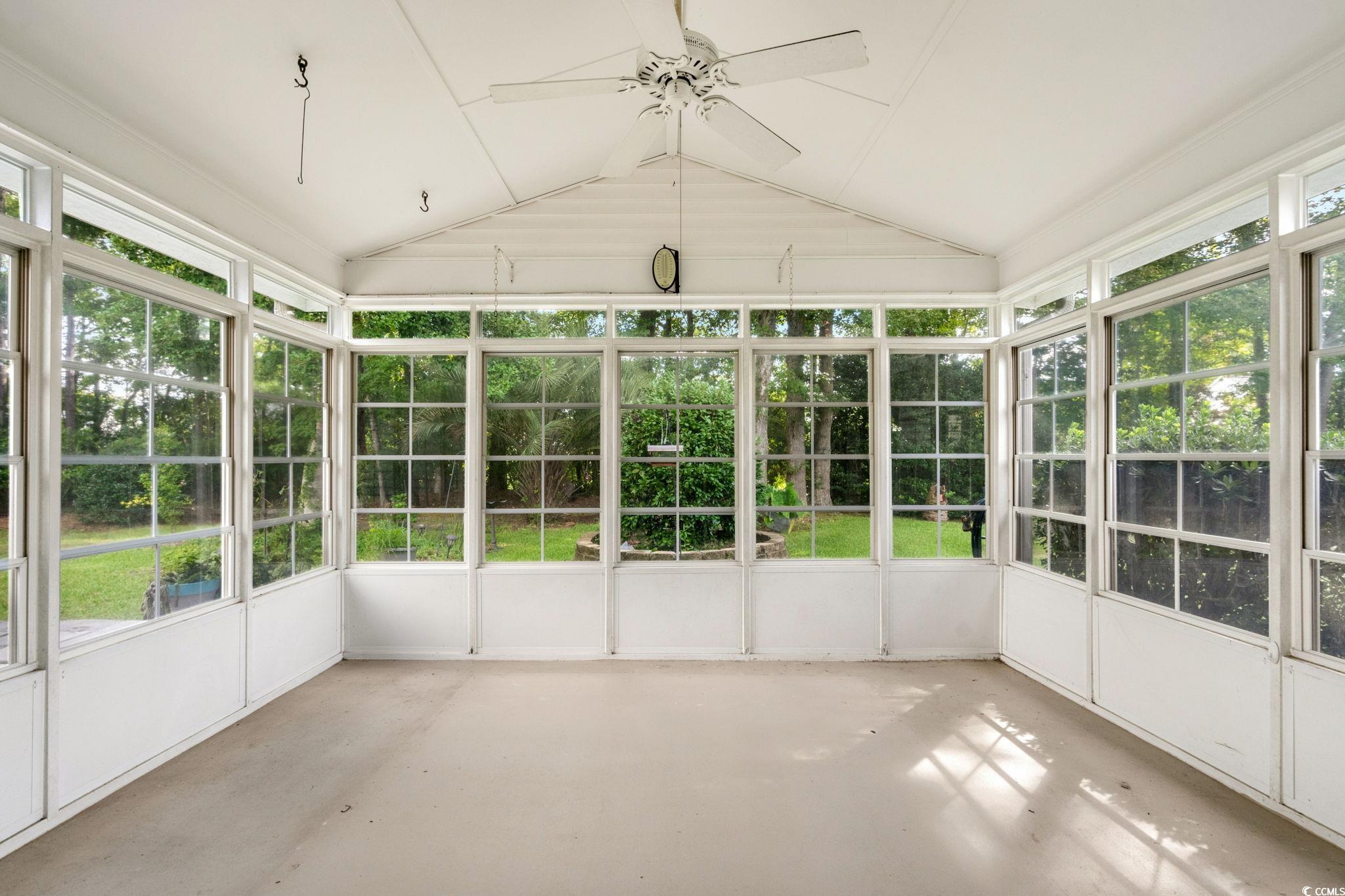 9568 Indigo Club Drive Murrells Inlet, SC 29576 - Photo 31 of 40 Unfurnished sunroom with vaulted ceiling and ceiling fan