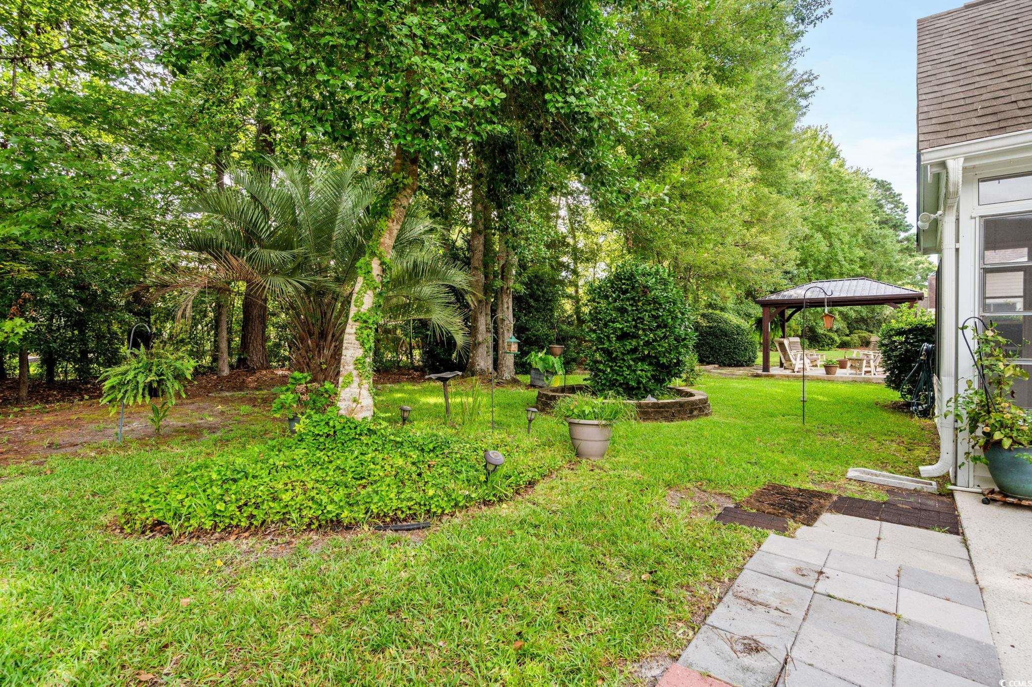 9568 Indigo Club Drive Murrells Inlet, SC 29576 - Photo 35 of 40 View of grassy yard with a gazebo and a patio area