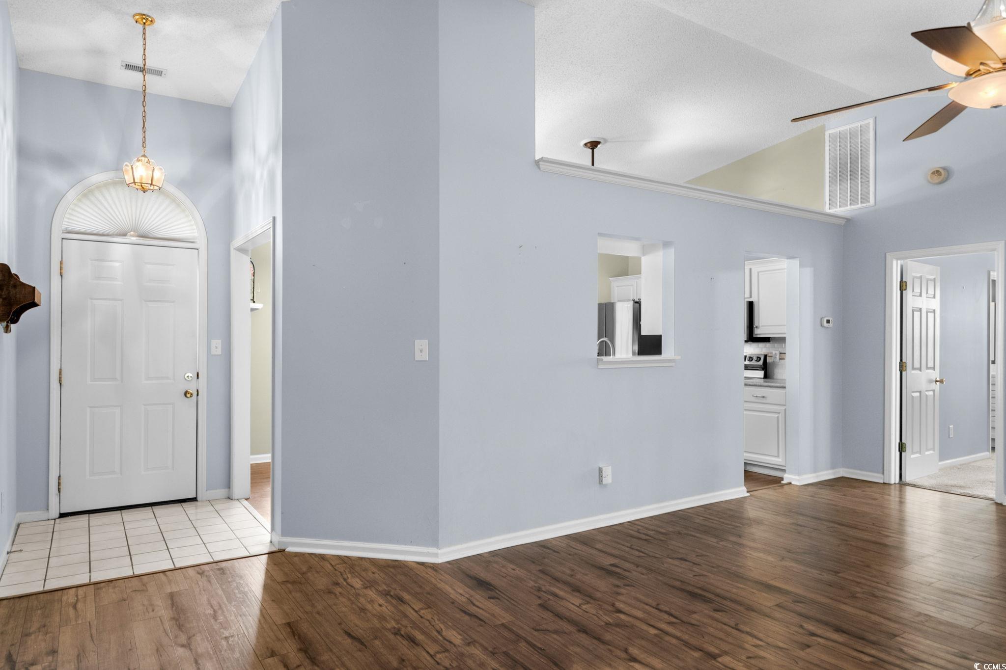 9568 Indigo Club Drive Murrells Inlet, SC 29576 - Photo 9 of 40 Foyer entrance featuring dark wood-style flooring and ceiling fan