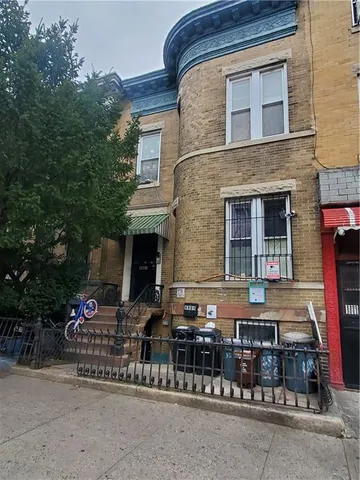 a front view of house with yard outdoor seating and barbeque oven