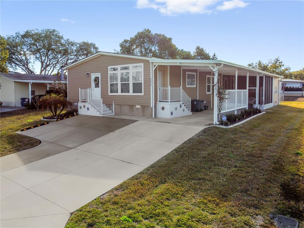 a front view of a house with yard outdoor seating and barbeque oven