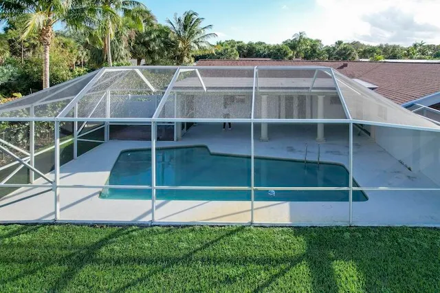 a bathroom with a sink toilet and window