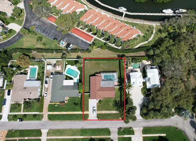 a kitchen with stainless steel appliances a refrigerator and a stove top oven